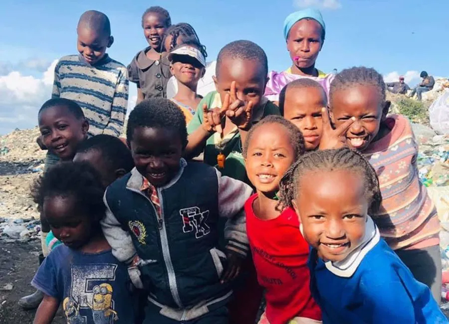A photo of a group of children smiling at the camera