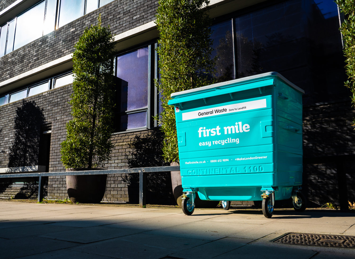 Large First Mile bin outside an office building