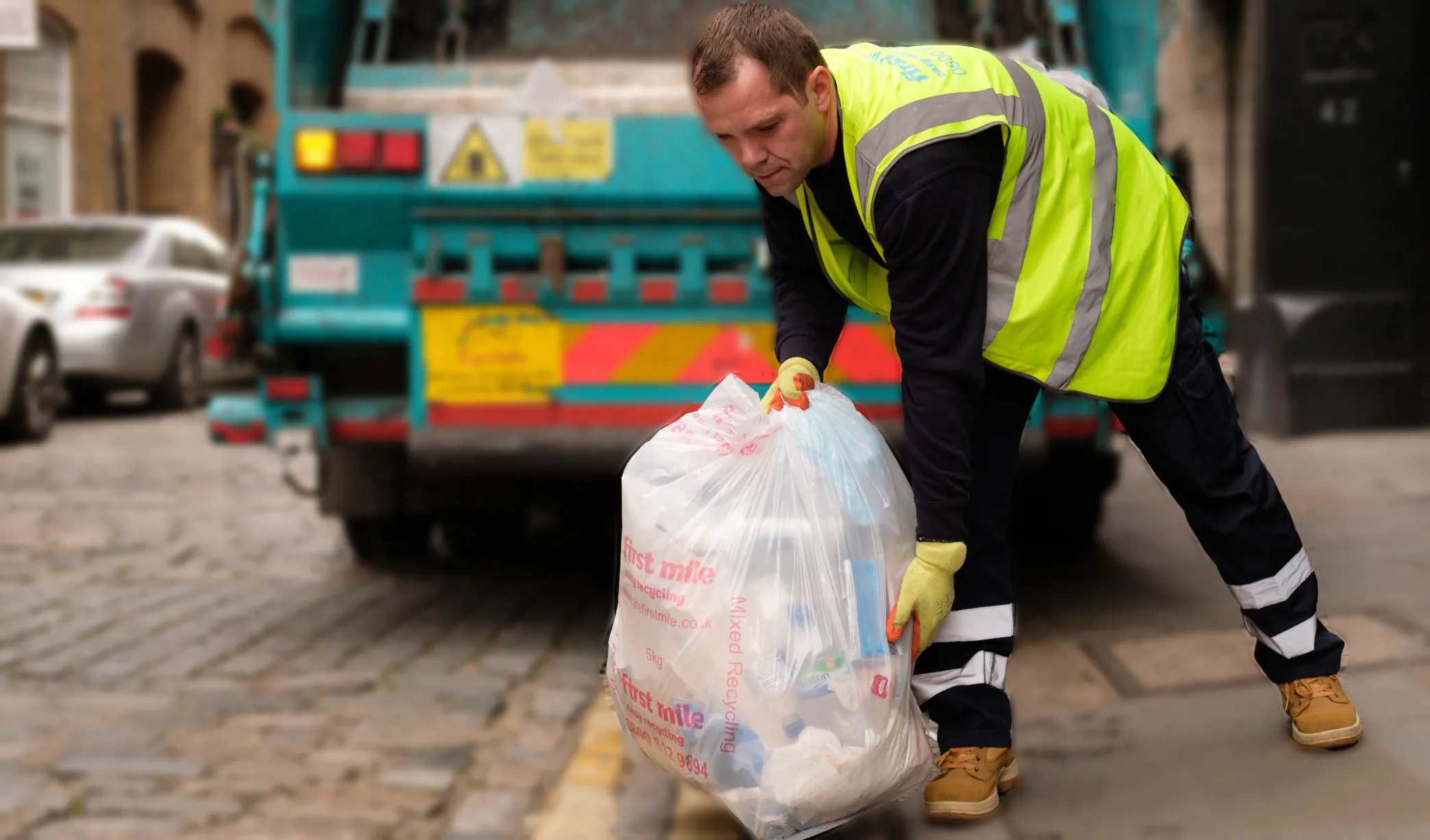 First mile driver collecting rubbish bags