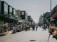 Busy local high street full of shops and people